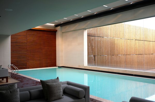 What are the best methods for controlling humidity in an indoor UK swimming pool?